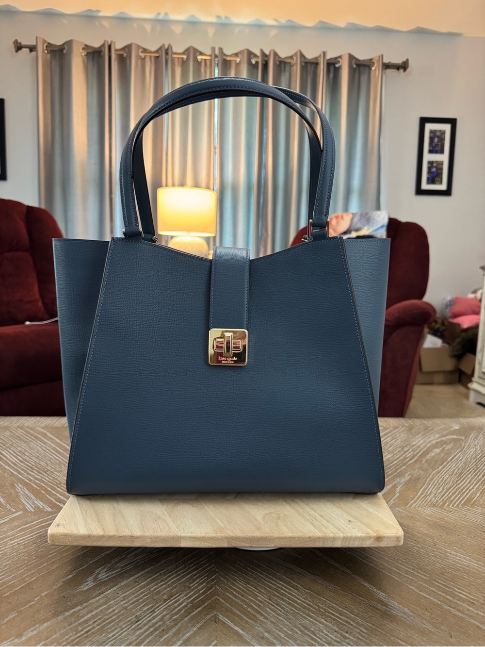 Kate Spade Phoebe Large Tote in bluestone features a refined grain leather.